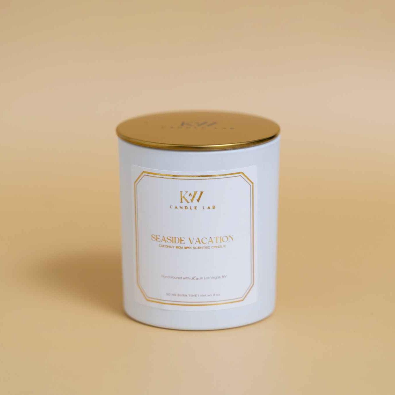 seaside vacation candle tan background