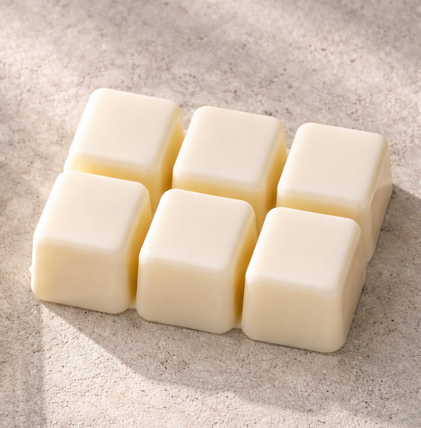 Six Vanilla Cashmere wax melt cubes made with our proprietary soy wax and beeswax blend.