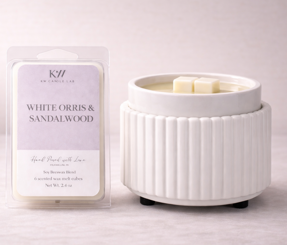 KW Candle Lab White Orris & Sandalwood luxury wax melts displayed beside an electric ceramic wax warmer for a clean, flameless home fragrance experience.