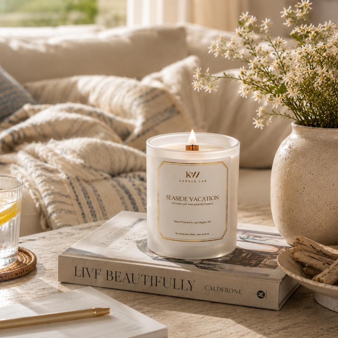 Seaside Vacation wood wick coconut soy candle styled in a bright coastal home overlooking the ocean.