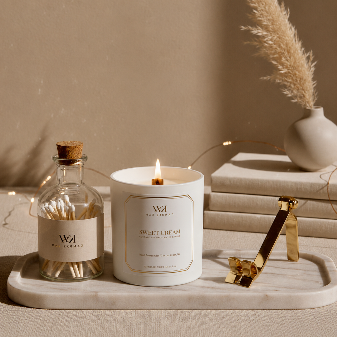 KW Candle Lab sweet cream  luxury candle lifestyle photoshoot candle and matches on a tray with decorative elements against a beige wall